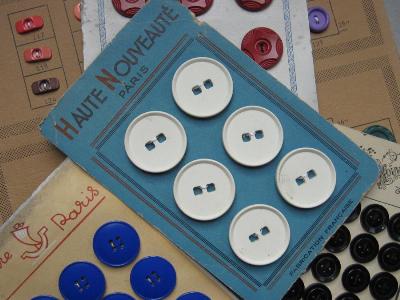 Buttons and buckles - French white buttons on card